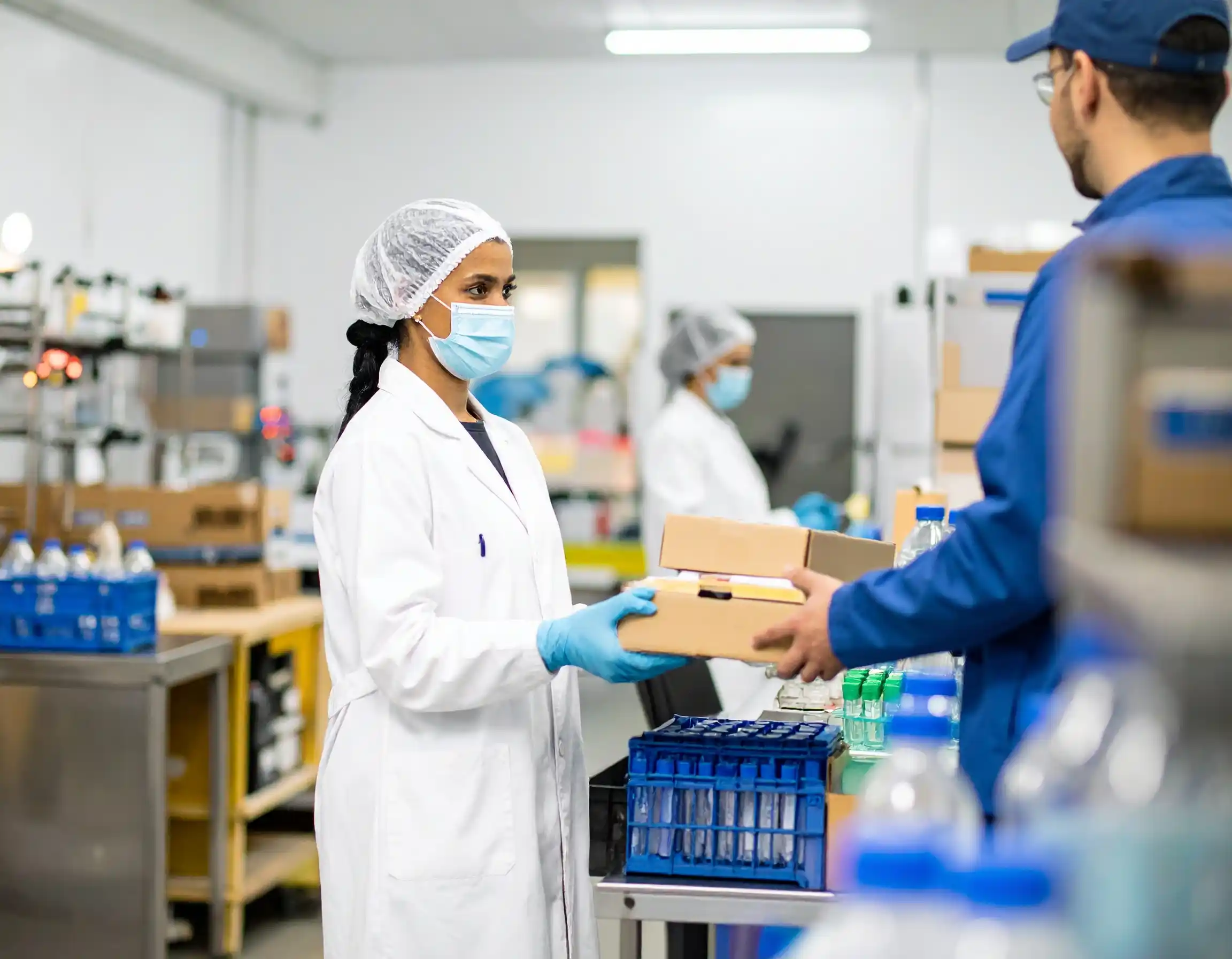 A courier handing a package to a professional in a modern office in Jacksonville